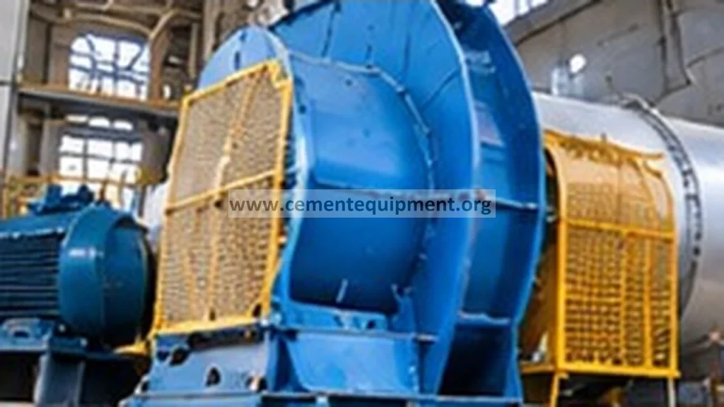 Centrifugal cooling fan and motor serving a clinker grate cooler in a cement plant