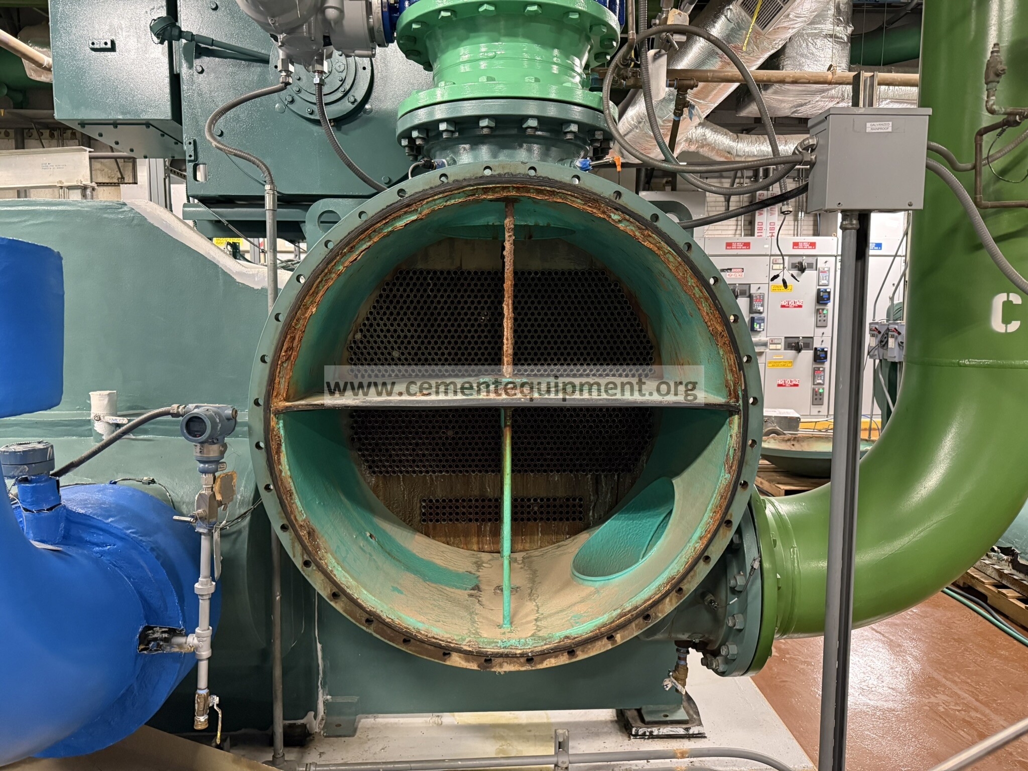Opened industrial shell-and-tube heat exchanger showing its tube bundle during inspection after cleaning
