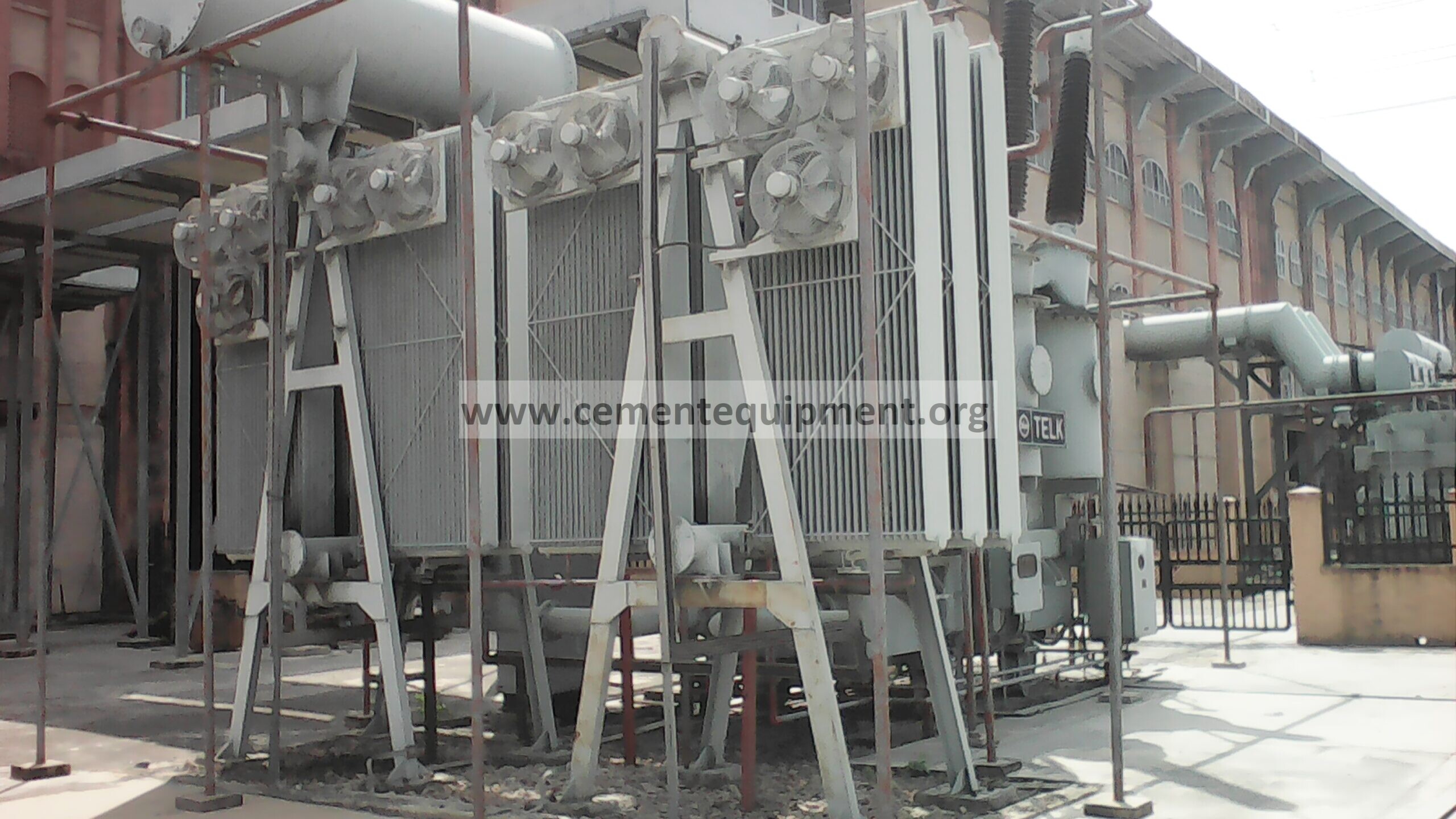 Oil-immersed power transformer cooling radiators and fans used to diagnose high transformer oil temperature at normal load